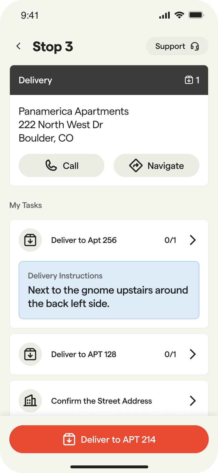 Mobile app screen showing delivery stop details with apartment address, delivery tasks, instructions, and a red ‘Deliver to APT 214’ button at the bottom.
